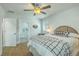 Bedroom with ceiling fan featuring bed, side table, and ensuite bathroom with tile shower at 1247 Oakcrest Dr, Charleston, SC 29412