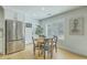 Cozy kitchen nook with stainless steel refrigerator and bright, natural light at 1247 Oakcrest Dr, Charleston, SC 29412