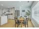 Cozy dining area next to the kitchen, filled with natural light from nearby window at 1247 Oakcrest Dr, Charleston, SC 29412