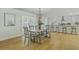 Dining room with a large table and chandelier, connected to the modern kitchen at 1247 Oakcrest Dr, Charleston, SC 29412