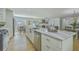 Open-concept kitchen with island seating flows seamlessly into the living room and dining area at 1247 Oakcrest Dr, Charleston, SC 29412