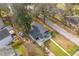 Aerial view captures the home's well-maintained lawn, new roof, and neighborhood's mature trees at 1249 Sumner Ave, North Charleston, SC 29406