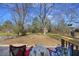 Relaxing backyard view from the deck with trees providing shade at 127 Ridge Rd, Summerville, SC 29485