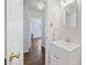 Clean and bright bathroom with white vanity, neutral walls, and a view of the hallway at 127 Ridge Rd, Summerville, SC 29485