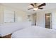 Cozy bedroom features wainscoting, built-in shelves, and an ensuite bathroom at 127 Ridge Rd, Summerville, SC 29485