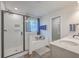 Bright bathroom featuring a shower, soaking tub with wood caddy, and a double sink vanity at 132 Mcclellan Way, Summerville, SC 29483