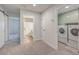 Hallway with carpet that has access to the laundry room and bathroom at 132 Mcclellan Way, Summerville, SC 29483