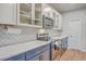 Beautiful kitchen with granite countertops, stainless steel appliances, and custom backsplash at 132 Mcclellan Way, Summerville, SC 29483