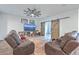 Spacious living room with entertainment center, ceiling fan and sliding barn doors at 132 Mcclellan Way, Summerville, SC 29483