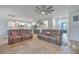 Open-concept living room has wood floors, an updated kitchen and comfortable seating at 132 Mcclellan Way, Summerville, SC 29483