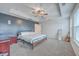 Bright main bedroom with a tray ceiling, neutral colors, and a ceiling fan at 132 Mcclellan Way, Summerville, SC 29483