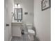 Chic powder room featuring modern fixtures, stylish tile flooring, and a decorative mirror at 132 Mcclellan Way, Summerville, SC 29483