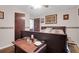 A bedroom with wood furniture, neutral walls, an area rug, and wall art in a traditional style at 133 Stephanie Cir, Summerville, SC 29483
