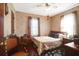 Bedroom with floral wallpaper, hardwood floors, a ceiling fan, and natural light from the window at 133 Stephanie Cir, Summerville, SC 29483