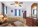 Bedroom features a ceiling fan, dark wood furniture, soft carpet and a well-lit, neutral space at 133 Stephanie Cir, Summerville, SC 29483