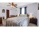 Bedroom featuring a ceiling fan, window AC unit, and comfortable bedding at 133 Stephanie Cir, Summerville, SC 29483