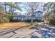 Inviting exterior of the home featuring a well-maintained lawn and mature trees for added character at 133 Stephanie Cir, Summerville, SC 29483