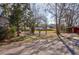Cozy home featuring mature trees and lush landscaping for serene curb appeal and natural shade at 133 Stephanie Cir, Summerville, SC 29483