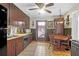 Functional kitchen with dark wood cabinetry, tile flooring, and a cozy dining nook at 133 Stephanie Cir, Summerville, SC 29483