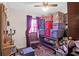 A storage room filled with various-sized bins and containers, and organized on shelves under the window at 133 Stephanie Cir, Summerville, SC 29483