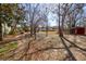 View of the large yard featuring dry lawn, trees, and home at 133 Stephanie Cir, Summerville, SC 29483