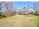 View of the large yard featuring dry lawn and tree coverage at 133 Stephanie Cir, Summerville, SC 29483
