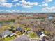 Aerial view of houses near the lake surrounded by lush greenery, offering scenic waterfront living at 135 Ashley Hill Dr, Goose Creek, SC 29445
