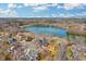 Stunning aerial view of a lakeside neighborhood, showcasing the serene lake and beautiful surrounding landscape at 135 Ashley Hill Dr, Goose Creek, SC 29445