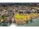 Expansive aerial view of waterfront property with lush green lawns and mature trees along a scenic river at 135 Ashley Hill Dr, Goose Creek, SC 29445