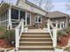 Multi-level back deck with stairs, white railings, and flower pots, offering a serene outdoor space at 135 Ashley Hill Dr, Goose Creek, SC 29445