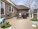 Back deck features a dining area, potted flowers and exterior views of the back of the home at 135 Ashley Hill Dr, Goose Creek, SC 29445