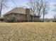 Brick home with a spacious backyard and screened porch, perfect for enjoying the outdoors at 135 Ashley Hill Dr, Goose Creek, SC 29445