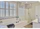 Modern bathroom with a soaking tub, glass shower, mosaic tile, and natural light from a window at 135 Ashley Hill Dr, Goose Creek, SC 29445