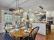 A dining room featuring a dining table, chairs, and a view into the bright, remodeled kitchen at 135 Ashley Hill Dr, Goose Creek, SC 29445