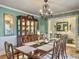 Dining room featuring a large wooden table with seating for ten, a china cabinet, and decorative accents at 135 Ashley Hill Dr, Goose Creek, SC 29445