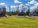 Scenic view of the golf course with well-maintained greens and several houses, providing a serene backdrop at 135 Ashley Hill Dr, Goose Creek, SC 29445