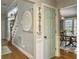Hallway with hardwood floors and a staircase leading upstairs to the bedrooms at 135 Ashley Hill Dr, Goose Creek, SC 29445