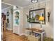 Hallway featuring hardwood floors, a console table with decor, and a built-in bookshelf at 135 Ashley Hill Dr, Goose Creek, SC 29445