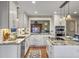 Well lit kitchen featuring granite countertops, a kitchen island, stainless steel appliances, and hardwood floors at 135 Ashley Hill Dr, Goose Creek, SC 29445