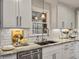 This bright kitchen features white cabinets, stainless steel appliances, subway tile, and granite countertops at 135 Ashley Hill Dr, Goose Creek, SC 29445