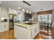 A kitchen island featuring hardwood floors, a cooktop, granite countertops, and stainless steel appliances at 135 Ashley Hill Dr, Goose Creek, SC 29445