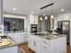This bright kitchen features a kitchen island, stainless steel appliances, hardwood floors and granite countertops at 135 Ashley Hill Dr, Goose Creek, SC 29445
