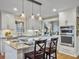Open-concept kitchen featuring granite countertops, stainless steel appliances, and pendant lighting at 135 Ashley Hill Dr, Goose Creek, SC 29445