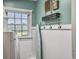 The laundry room is well-lit and features a modern washer and dryer at 135 Ashley Hill Dr, Goose Creek, SC 29445