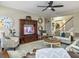 Open concept living room with ceiling fan, TV, stairs, and hardwood floors at 135 Ashley Hill Dr, Goose Creek, SC 29445