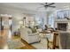 Bright living room featuring hardwood floors, a fireplace, and comfortable seating at 135 Ashley Hill Dr, Goose Creek, SC 29445