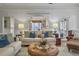 Cozy living room showcasing a pass-through to the kitchen, lots of light, and an open layout at 135 Ashley Hill Dr, Goose Creek, SC 29445
