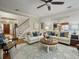 Living room boasting hardwood floors, access to kitchen and stairway, and an area rug at 135 Ashley Hill Dr, Goose Creek, SC 29445