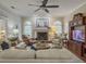 Comfortable living room featuring a ceiling fan, fireplace and a media center at 135 Ashley Hill Dr, Goose Creek, SC 29445
