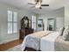 View of a bright main bedroom with hardwood floors, windows, and a mirrored dresser at 135 Ashley Hill Dr, Goose Creek, SC 29445